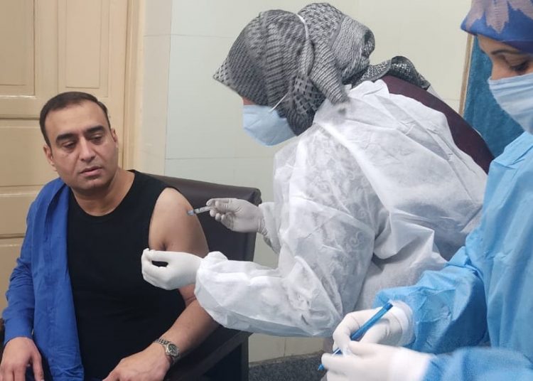 Dr Nisar ul Hassan Receives Covid19 Vaccine Jab at SMHS Hospital
